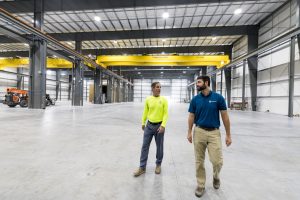 two men walking through industrial construction project in North Charleston